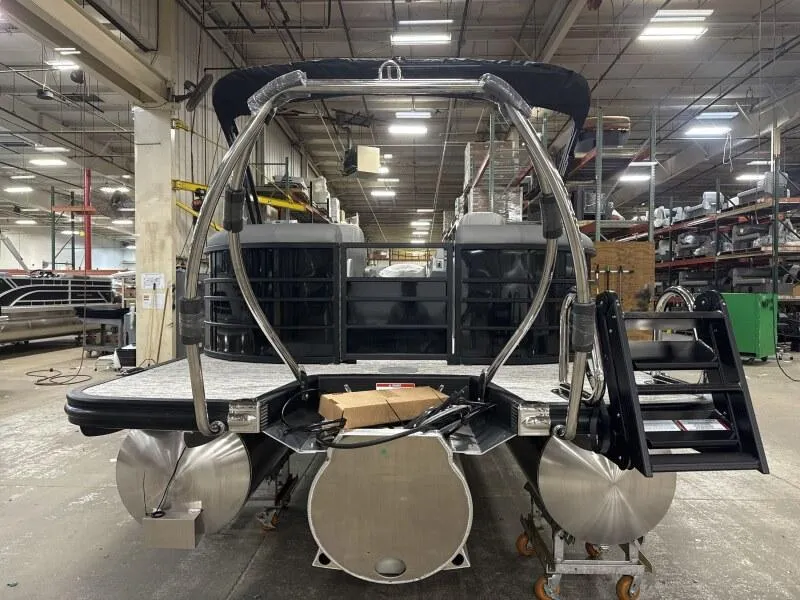 Slide: The Image of 2025 Bennington 22 LSRSE boat interior with luxurious gray captain's chair and cup holders. - 13