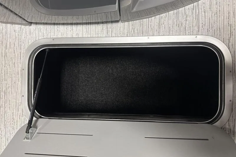 Slide: The Image of Storage compartment of 2025 Bennington 22 LSRSE boat, featuring sleek interior design. - 14