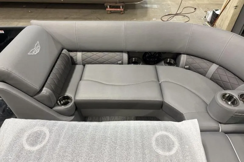 Slide: The Image of Luxurious seating in 2025 Bennington 22 LSRSE boat with gray upholstery and cup holders. - 16