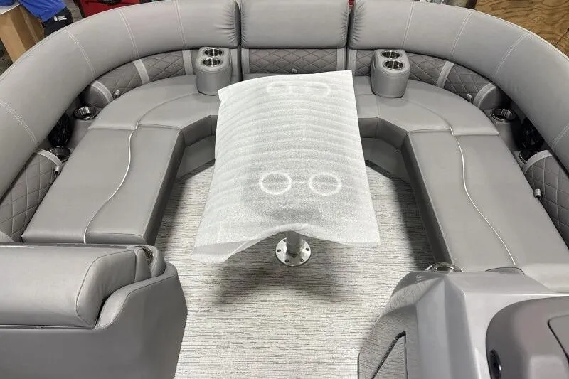 Slide: The Image of Luxurious seating area of 2025 Bennington 22 LSRSE pontoon boat with gray upholstery. - 18