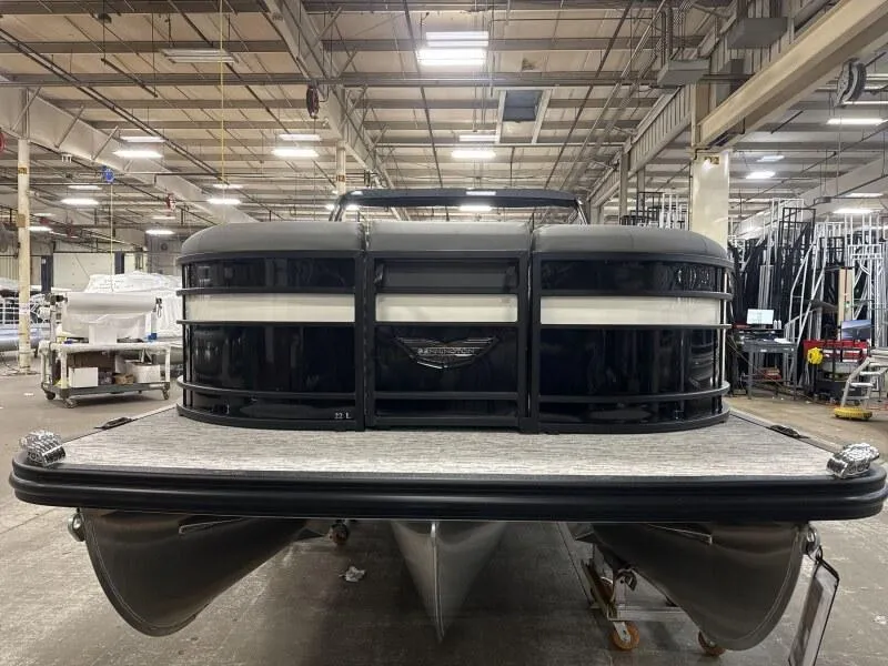 Slide: The Image of 2025 Bennington 22 LSRSE pontoon boat in a warehouse setting. - 3
