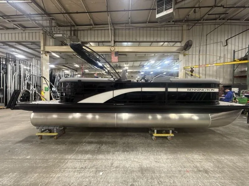 Slide: The Image of 2025 Bennington 22 LSRSE pontoon boat in a warehouse setting. - 4