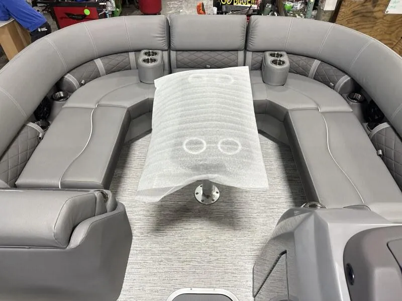 Slide: The Image of 2025 Bennington 22 LSRSE pontoon boat in a factory setting. - 5