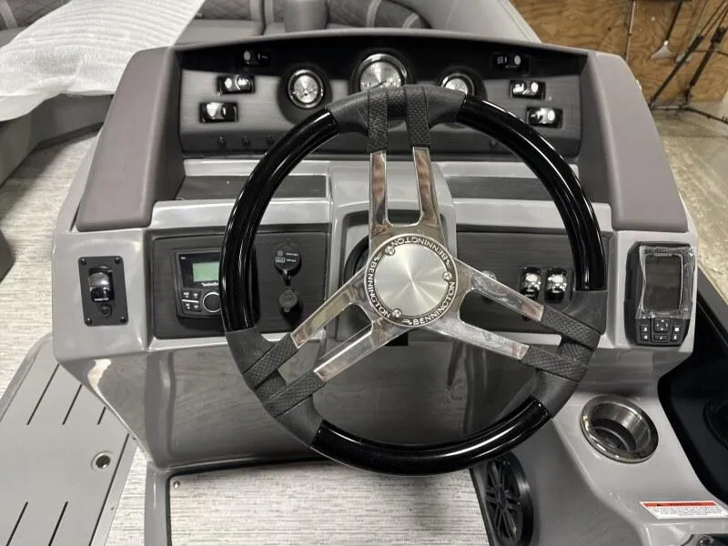 Slide: The Image of 2025 Bennington 22 LSRSE pontoon boat under assembly in a factory setting. - 6