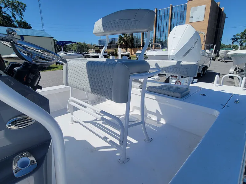 Slide: The Image of 2025 Blazer Bay 2420 GTS Deluxe boat with seating and console, parked outdoors. - 13