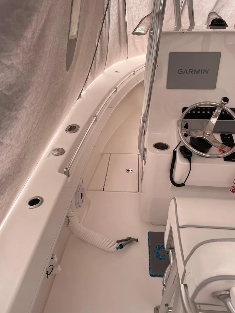 Slide: The Image of 2021 Contender Tournament boat interior with Garmin system and steering wheel. - 3