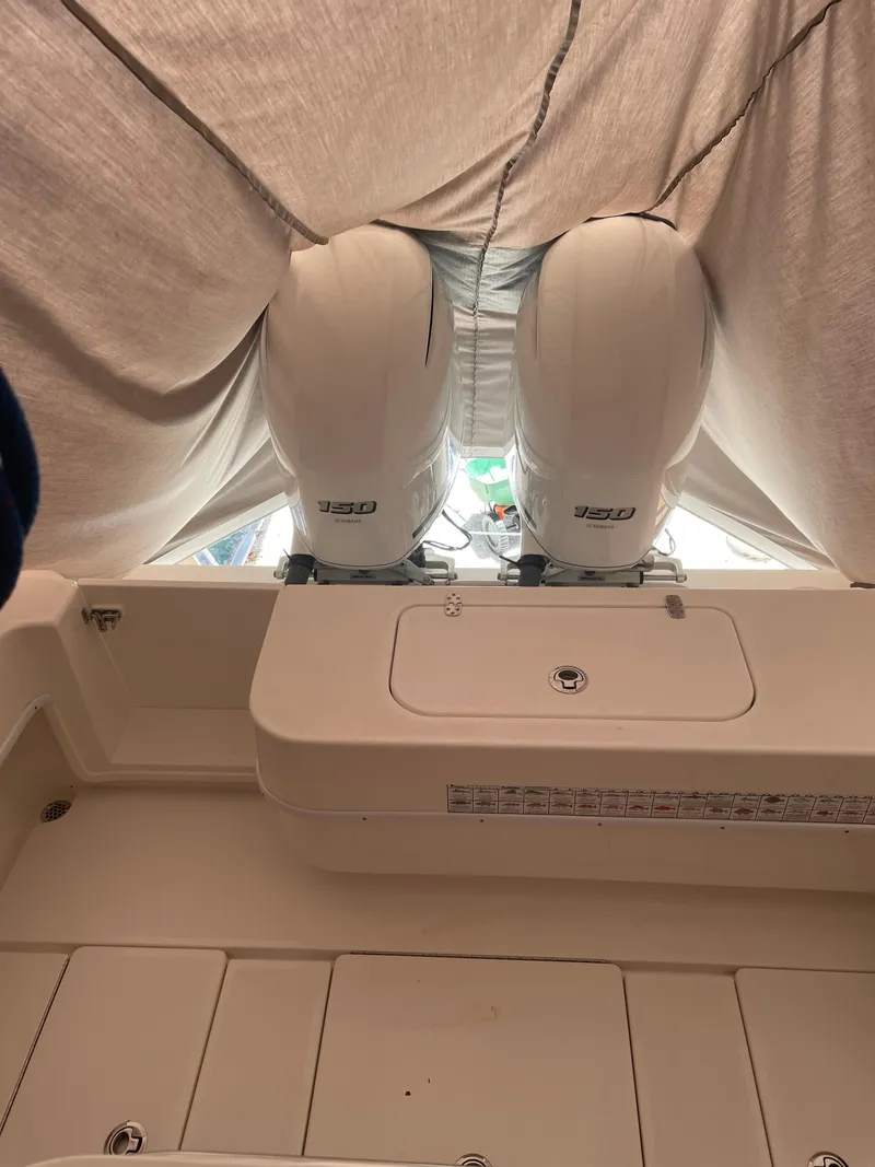 Slide: The Image of 2021 Contender Tournament boat with twin outboard engines under cover. - 5