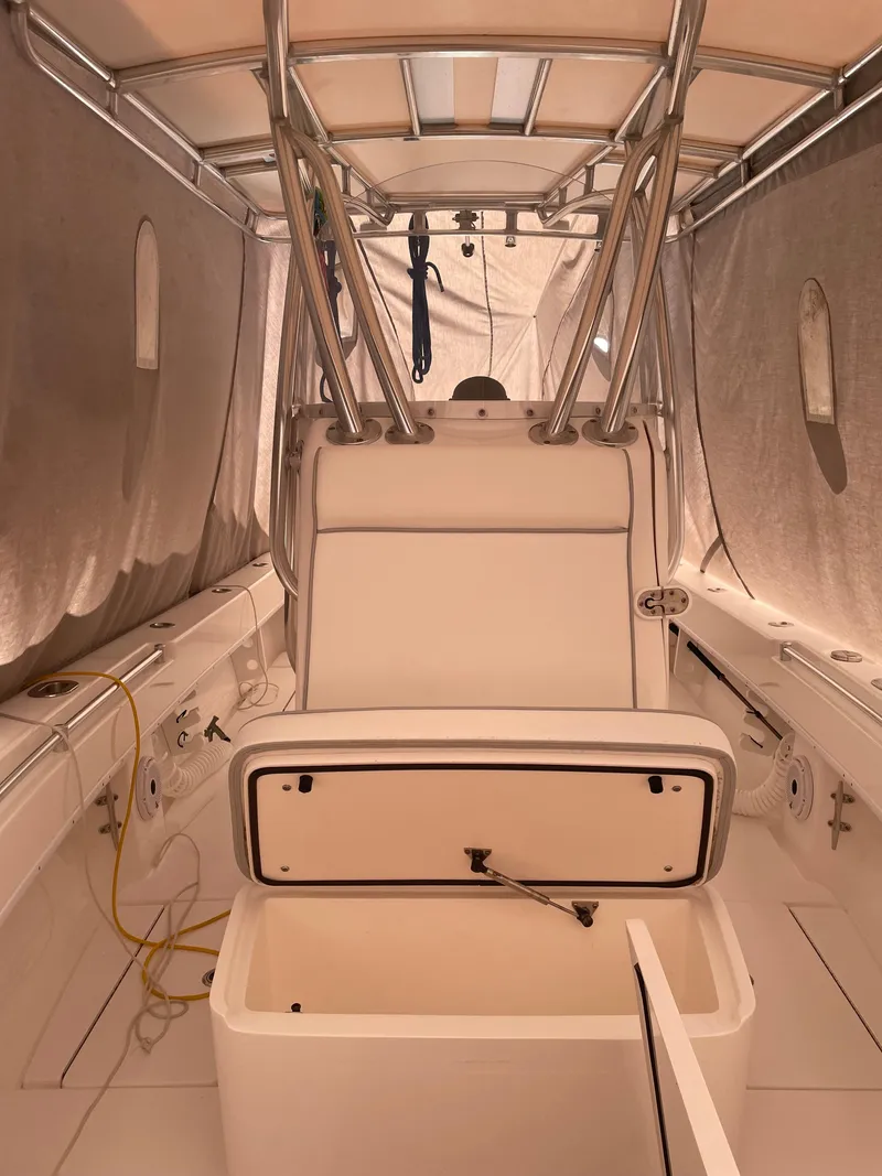 Slide: The Image of 2021 Contender Tournament boat interior with open storage compartment and sleek design. - 7