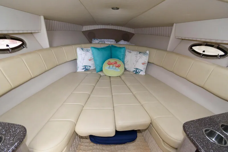 Slide: The Image of 2007 Formula 330 Sun Sport cabin with beige seating and decorative pillows. - 12