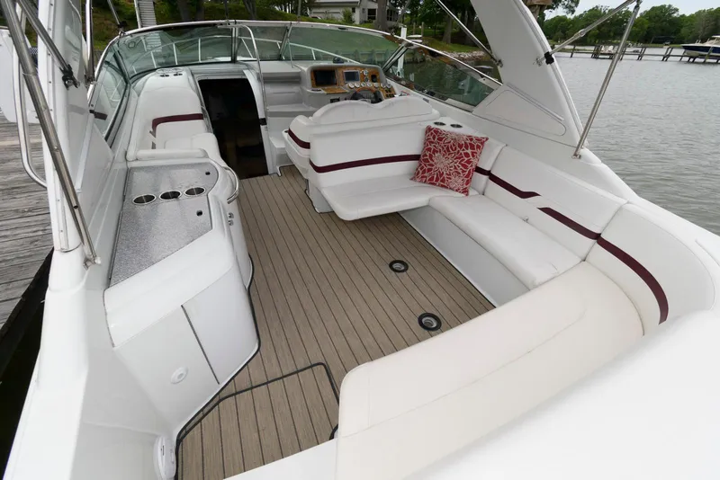 Slide: The Image of 2007 Formula 330 Sun Sport boat interior with white seating and wooden flooring. - 3