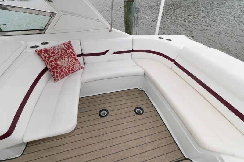 Slide: The Image of 2007 Formula 330 Sun Sport boat with white seating and red accents. - 7