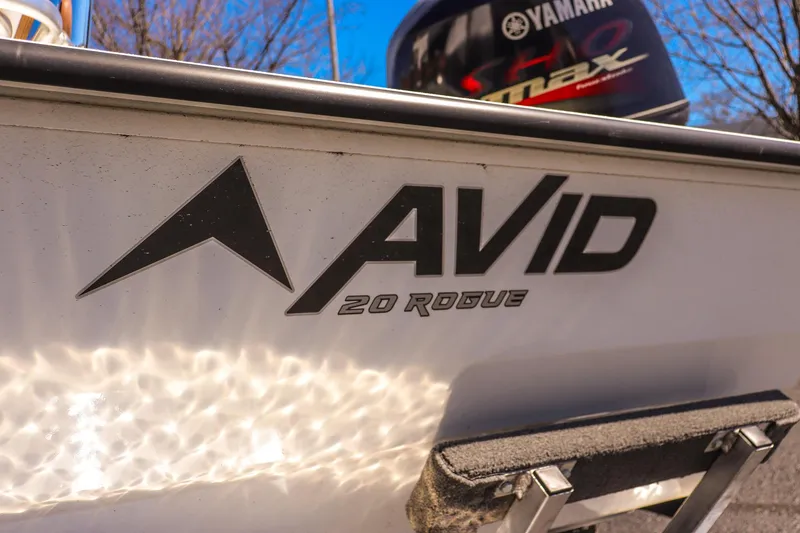 Slide: The Image of 2025 Avid 20 Rogue CC boat with Yamaha engine in sunlight. - 10