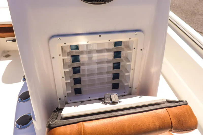 Slide: The Image of Avid 20 ROGUE CC 2025 boat console with storage compartments and leather seating. - 14