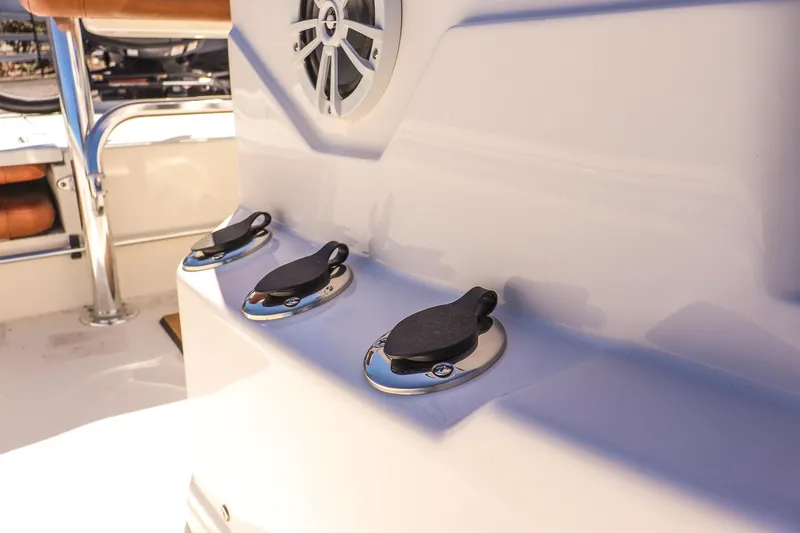 Slide: The Image of 2025 Avid 20 ROGUE CC boat console with speaker and control switches. - 16