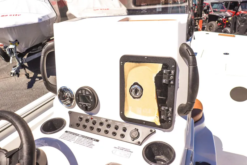 Slide: The Image of Avid 20 ROGUE CC 2025 boat console with controls and gauges. - 19