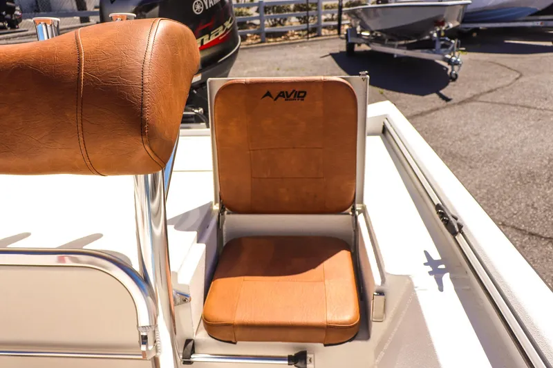 Slide: The Image of Avid 20 ROGUE CC 2025 boat seat with brown leather upholstery. - 22