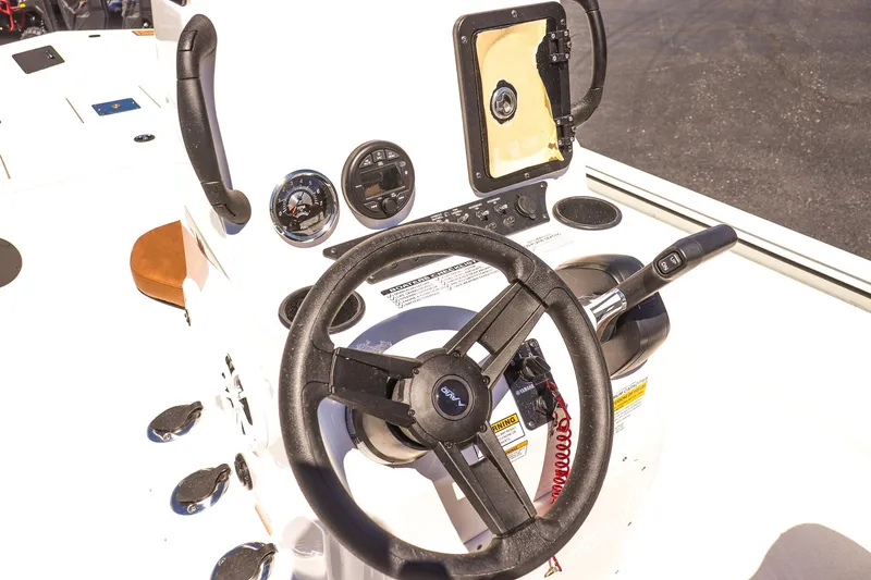 Slide: The Image of Steering console of 2025 Avid 20 ROGUE CC boat with gauges and controls. - 23