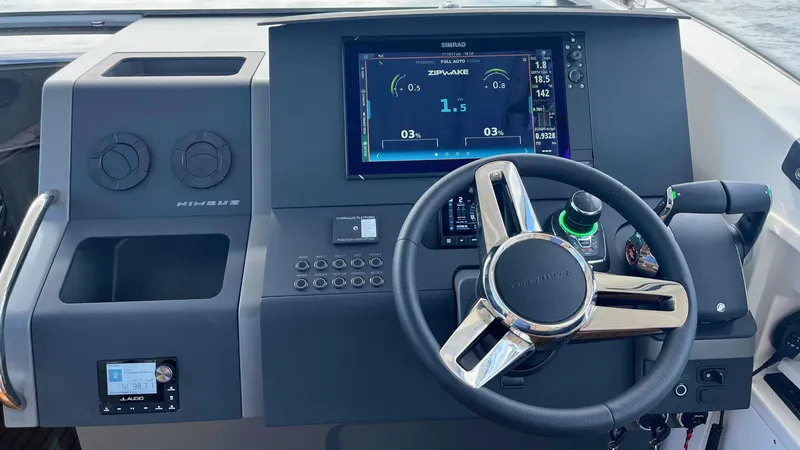 Slide: The Image of Steering console of 2025 Nimbus Weekender 11 #49 with digital display and controls. - 15