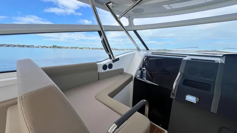 Slide: The Image of Interior of 2025 Nimbus Weekender 11 #49 boat with modern dashboard and seating. - 19