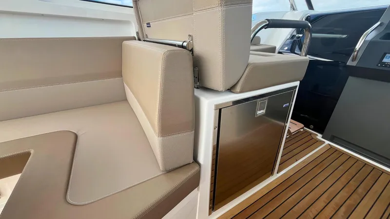 Slide: The Image of Luxurious interior of 2025 Nimbus Weekender 11 #49 with beige seating and wood flooring. - 20