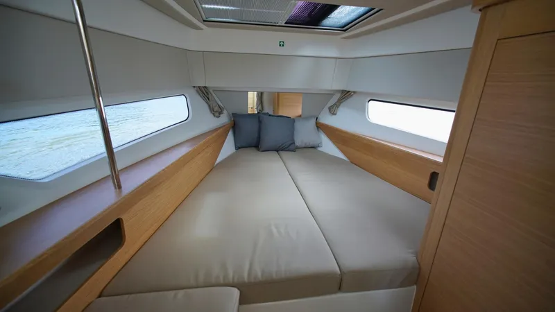 Slide: The Image of Cozy interior cabin of 2025 Nimbus Weekender 11, featuring comfortable bedding and modern design. - 29