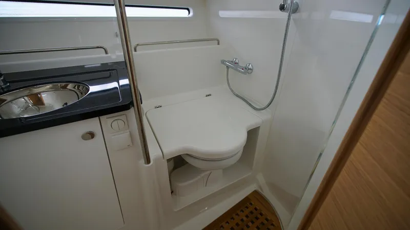 Slide: The Image of Compact bathroom in 2025 Nimbus Weekender 11 #49 boat, featuring toilet and sink. - 31