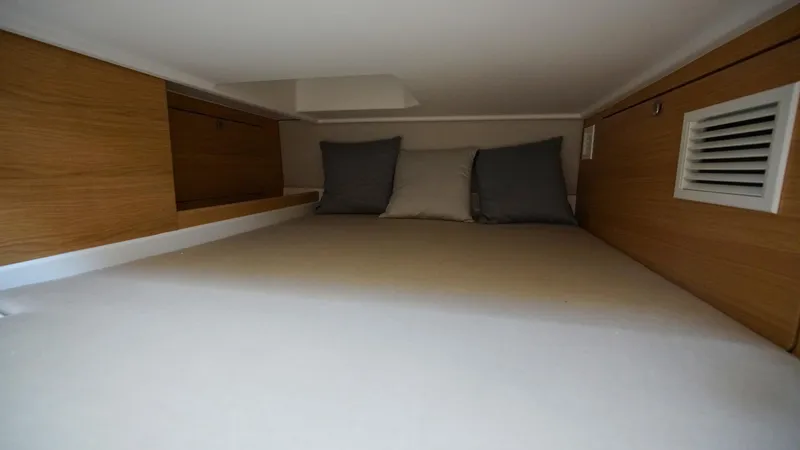 Slide: The Image of Cozy cabin interior of 2025 Nimbus Weekender 11 #49 with wooden accents and cushions. - 32