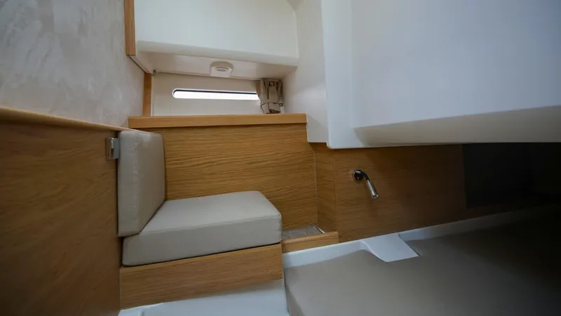 Slide: The Image of Interior of 2025 Nimbus Weekender 11 #49, featuring wooden paneling and cushioned seating. - 33