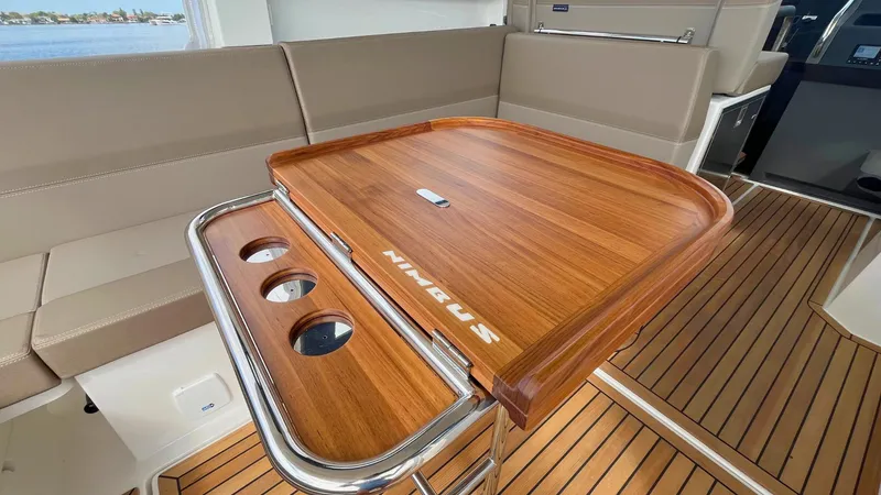 Slide: The Image of Luxurious interior of 2025 Nimbus Weekender 11, featuring elegant wooden table and seating. - 7