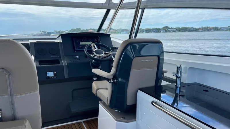 Slide: The Image of Modern helm of 2025 Nimbus Weekender 11 #49 with sleek design and water view. - 8