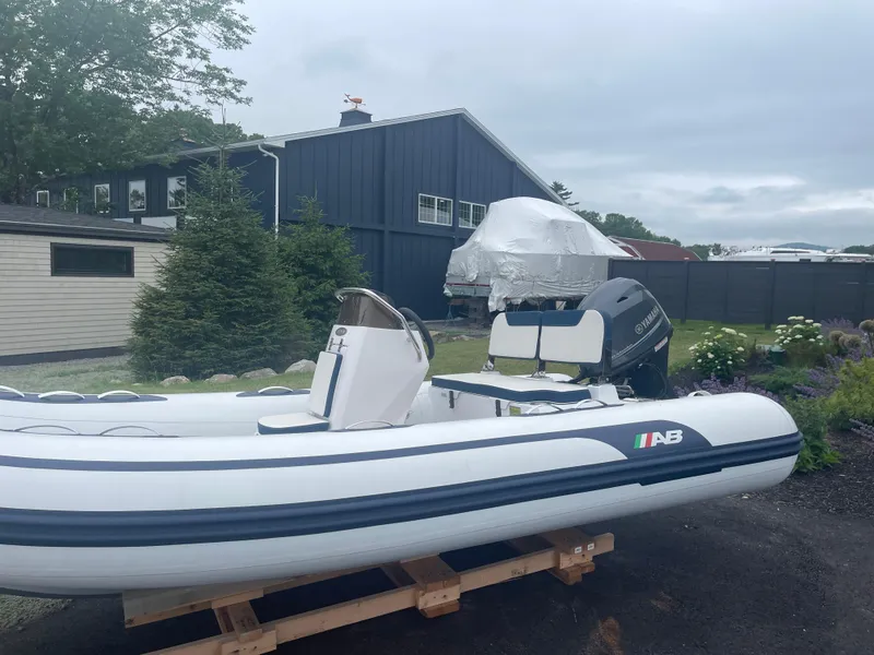 Slide: The Image of 2025 AB Inflatables Alumina 13 ALX with Yamaha outboard motor, featuring sleek design and modern controls. - 17