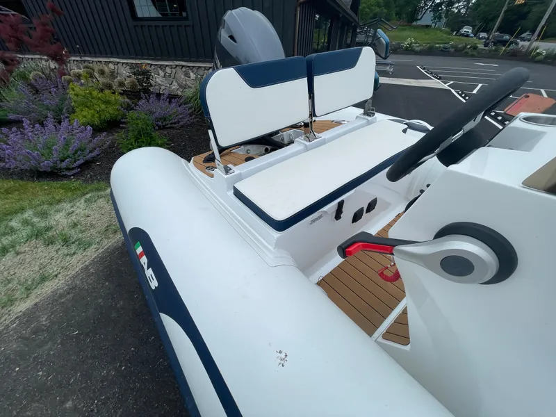 Slide: The Image of 2025 AB Inflatables Alumina 13 ALX boat interior with cushioned seating and storage. - 8
