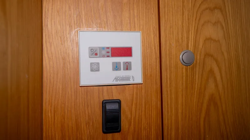 Slide: The Image of Control panel on 2005 Mainship 43 Trawler Aft Cabin wooden interior. - 25