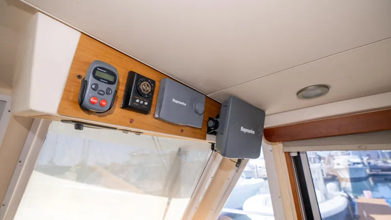 Slide: The Image of 2005 Mainship 43 Trawler Aft Cabin interior with navigation equipment and controls. - 33