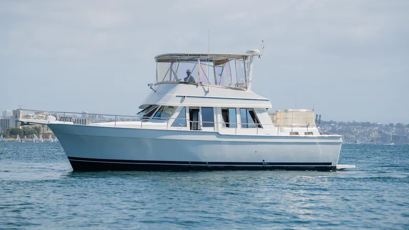 Slide: The Image of 2005 Mainship 43 Trawler Aft Cabin cruising on calm waters. - 4