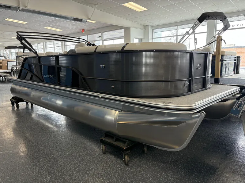 The Image of 2025 Crest 220SLRC pontoon boat displayed indoors, showcasing sleek design and modern features. - 0