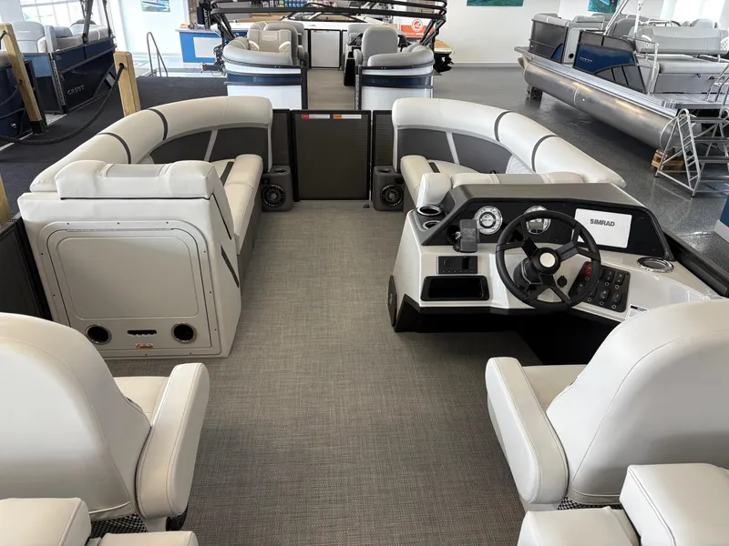 Slide: The Image of 2025 Crest 220SLRC pontoon boat interior with modern seating and steering console. - 4