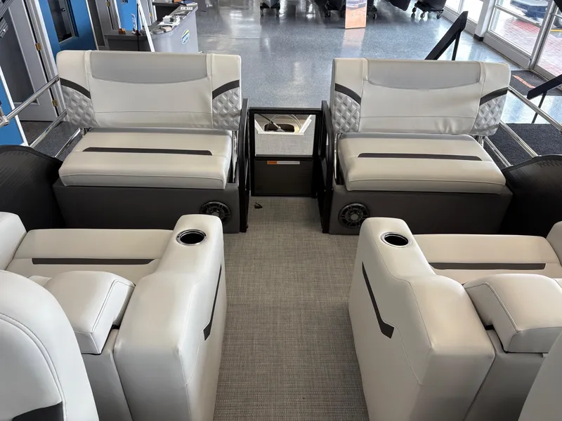 Slide: The Image of 2025 Crest 220SLRC boat interior with luxurious seating and cup holders. - 6