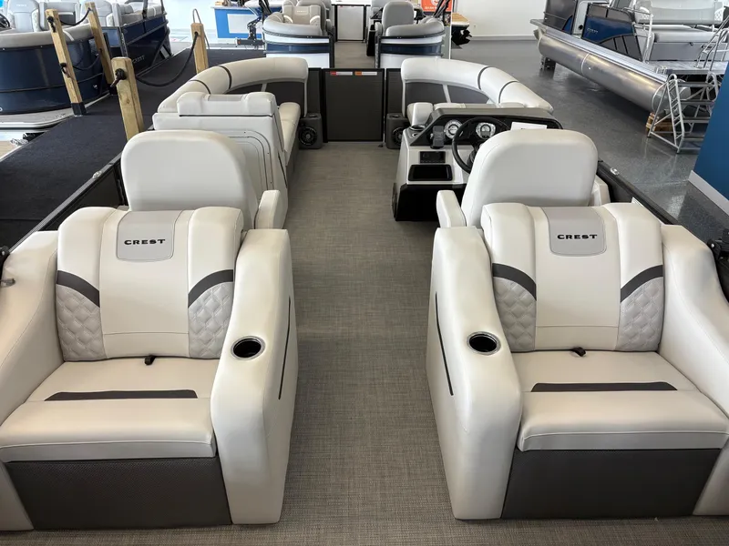 Slide: The Image of 2025 Crest 220SLRC pontoon boat interior with luxurious seating and modern dashboard. - 7