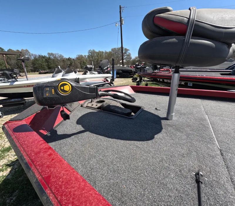 Slide: The Image of 2023 Ranger RT188 boat deck with seat and trolling motor, in a sunny outdoor setting. - 3