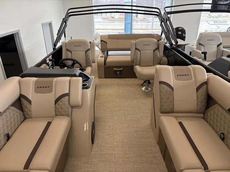 Slide: The Image of 2025 Crest 220 SLSC boat interior with luxurious beige seating and modern design. - 4