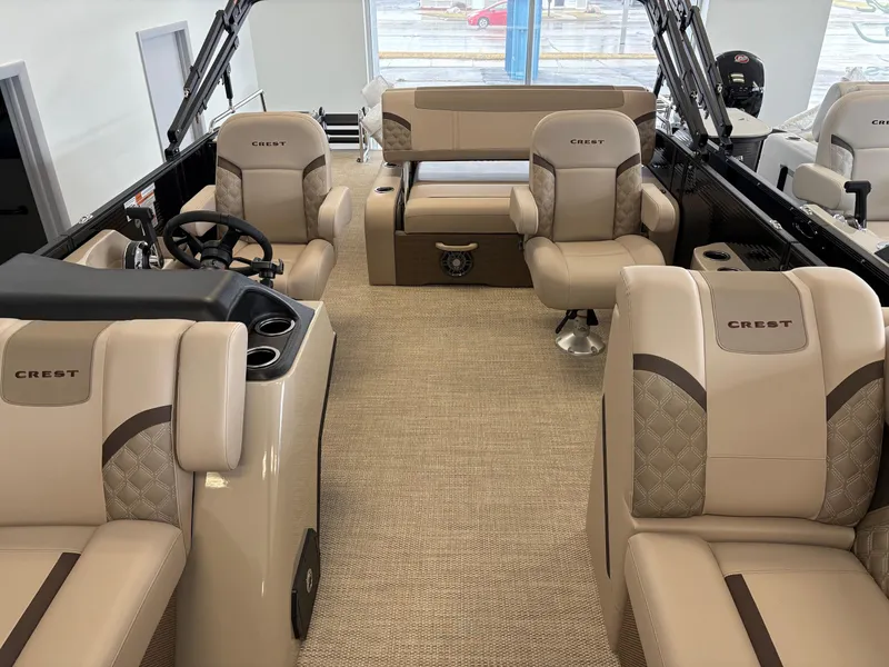 Slide: The Image of 2025 Crest 220 SLSC boat interior with luxurious beige seating and modern design. - 5