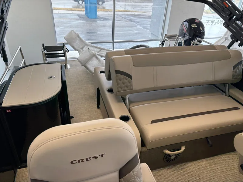 Slide: The Image of 2025 Crest 220 SLSC boat interior with seating and helm, showcasing modern design and comfort. - 6