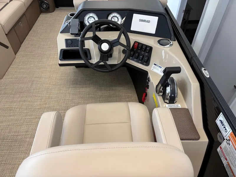 Slide: The Image of 2025 Crest 220 SLSC boat interior with steering wheel and control panel. - 8