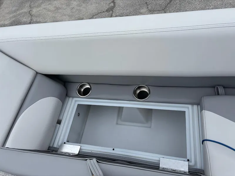 Slide: The Image of 2025 SunCatcher Select 322RF boat seating with built-in storage and cup holders. - 14