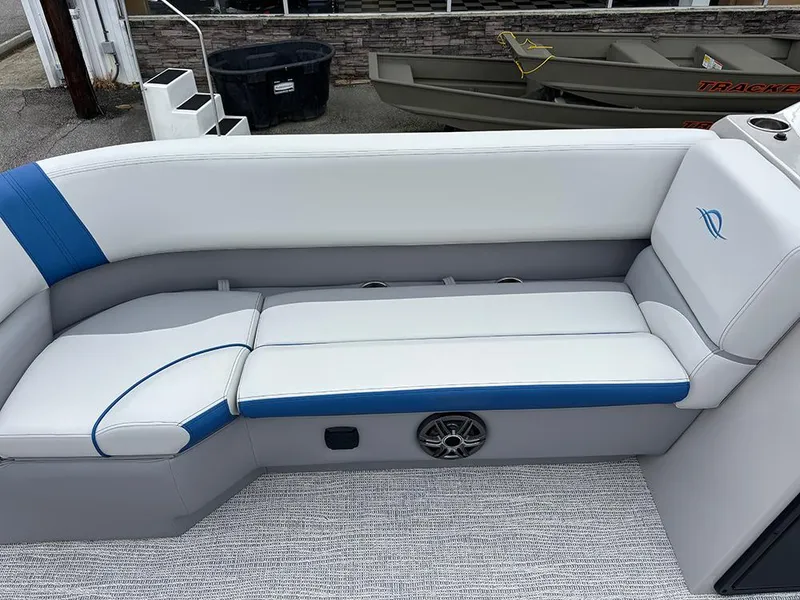 Slide: The Image of 2025 SunCatcher Select 322RF boat interior with white and blue seating. - 15