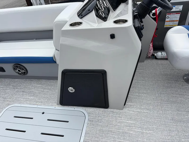 Slide: The Image of 2025 SunCatcher Select 322RF boat console with seating and storage compartment. - 20