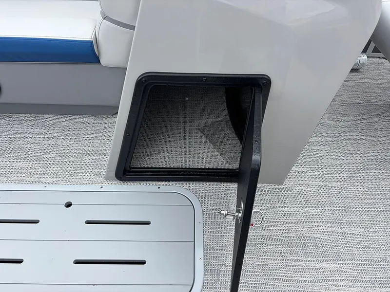 Slide: The Image of 2025 SunCatcher Select 322RF boat storage compartment with open hatch on deck. - 21