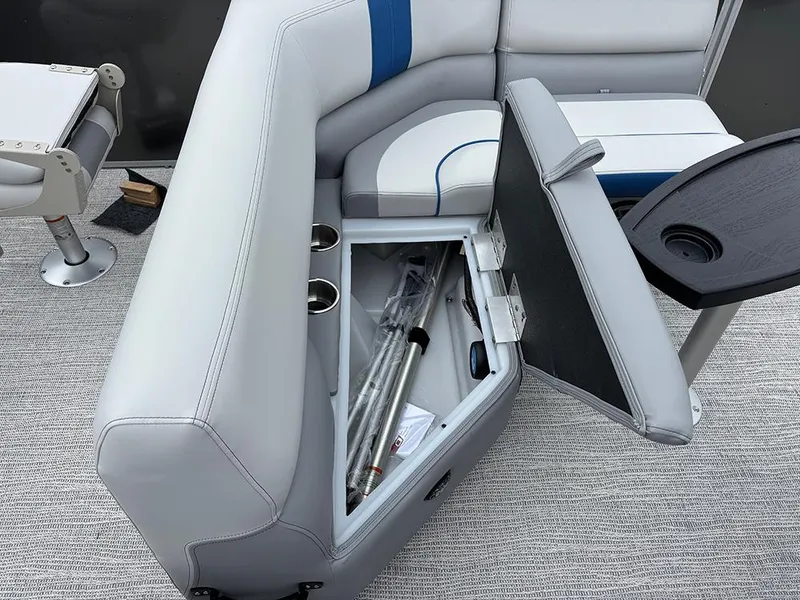Slide: The Image of 2025 SunCatcher Select 322RF boat interior with open storage compartment and seating. - 27