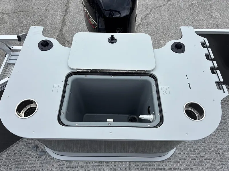 Slide: The Image of 2025 SunCatcher Select 322RF boat deck with storage compartment and cup holders. - 29